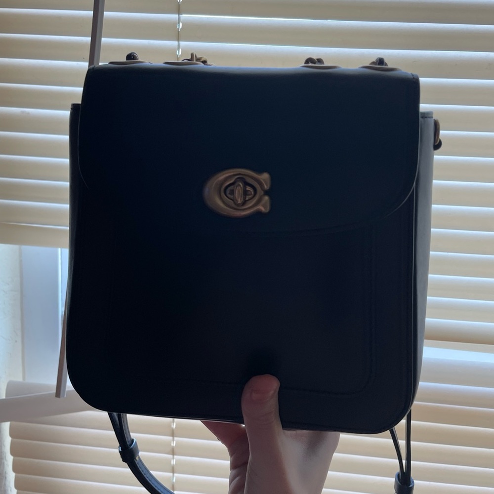 Coach bag can be used as a backpack or a purse